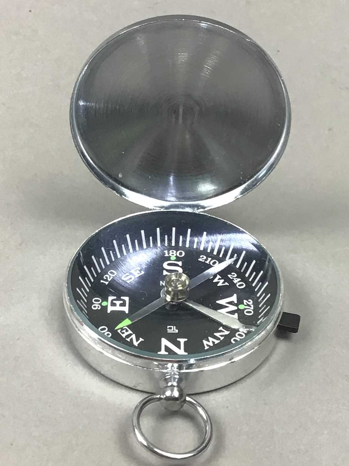 Lot 101 Four Pocket Compasses