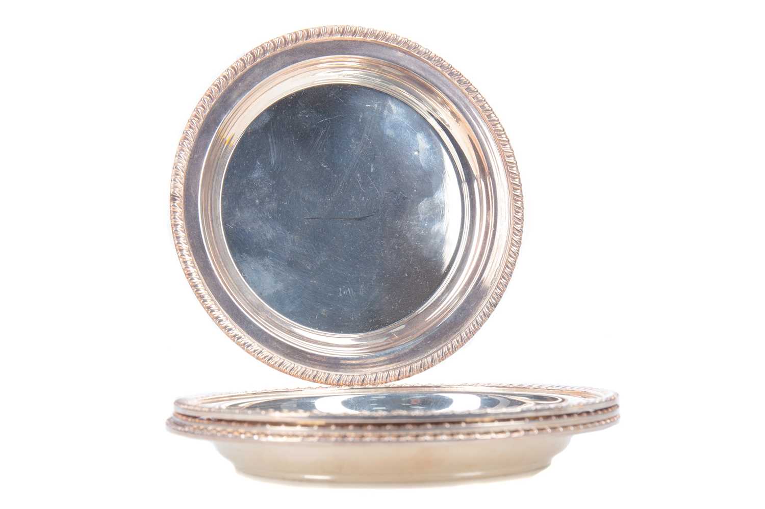 Lot 10 - FOUR ELIZABETH II SILVER BOTTLE COASTERS