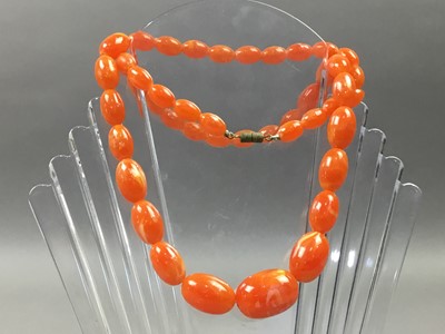 Lot 65 - AN ORANGE BEAD NECKLACE