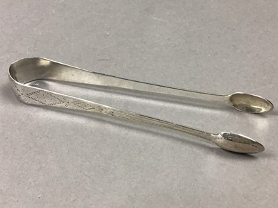 Lot 149 - A PAIR OF GEORGE III BRIGHT CUT SUGAR TONGS