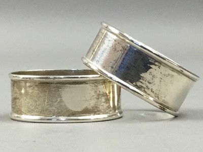 Lot 161 - A SET OF EIGHT SILVER OVAL NAPKIN RINGS AND OTHERS