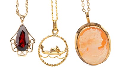 Lot 564 - A CAMEO PENDANT, RED GEM SET PENDANT AND AN OPENWORK PENDANT