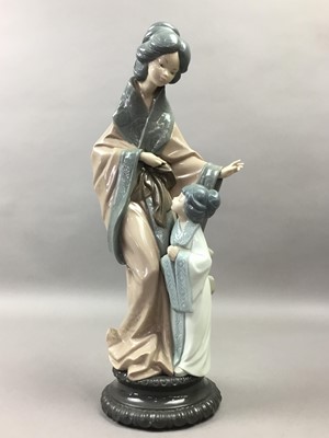 Lot 293 - A NAO FIGURE OF A JAPANESE WOMAN AND CHILD AND SEVEN OTHER SIMILAR FIGURES