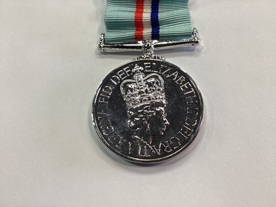 Lot 73 - AN ELIZABETH II 1980 RHODESIA MEDAL AND ZIMBABWE INDEPENDENCE MEDAL
