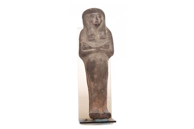 Lot 112 - AN EGYPTIAN POTTERY SHABTI