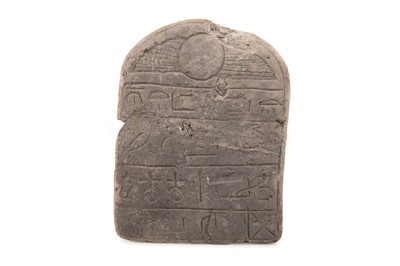 Lot 122 - AN EGYPTIAN ROUND TOPPED STONE STELA