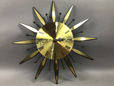 Lot 233 - A KIENZLE STARBURST CLOCK, THREE OTHER WALL CLOCKS AND A LAZY SUSAN