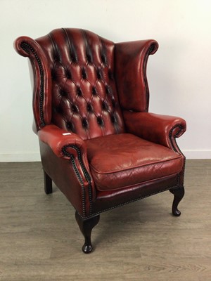 Lot 318 - A PAIR OF OXBLOOD CHESTERFIELD WING BACK ARMCHAIRS