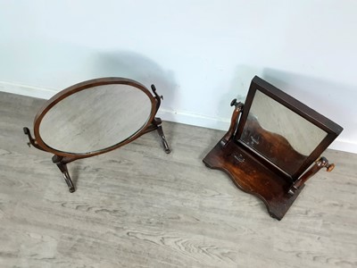 Lot 259 - A MAHOGANY OVAL DRESSING GLASS AND ANOTHER
