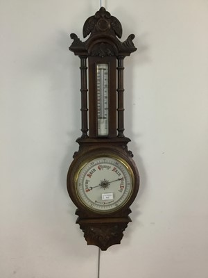 Lot 512 - A VICTORIAN CARVED OAK BAROMETER