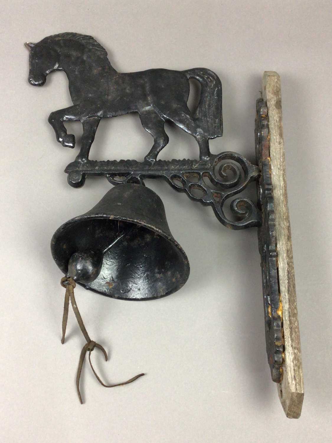 Lot 479 - A WALL MOUNTED CAST IRON BELL AND WALL HANGINGS