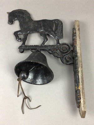 Lot 479 - A WALL MOUNTED CAST IRON BELL AND WALL HANGINGS