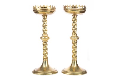 Lot 858 - A PAIR OF VICTORIAN ECCLESIASTICAL BRASS CANDLESTICKS