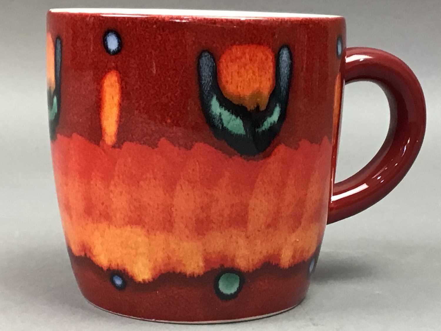 Lot 640 - POOLE POTTERY FOUR VOLCANIC RANGE MUGS