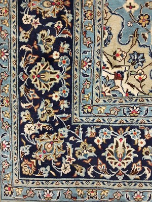 Lot 869 - A PERSIAN KASHAN RUG