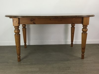 Lot 72 - A PINE EFFECT DINING TABLE AND SIX CHAIRS