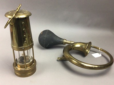 Lot 74 - A MINER'S LAMP AND A BRASS CAR HORN
