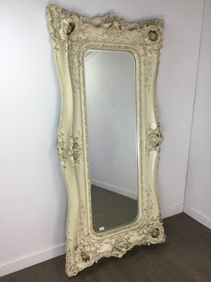 Lot 887 - A LARGE MOULDED WALL MIRROR IN THE ROCOCO TASTE