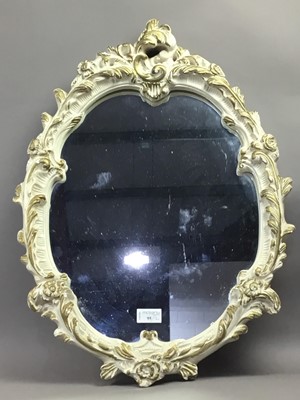 Lot 95 - CREAM AND GILT ORNATE WALL MIRROR ALONG WITH AN OVAL WALL MIRROR