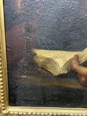 Lot 413 - READING MAN, AN OIL IN THE MANNER OF CARAVAGGIO