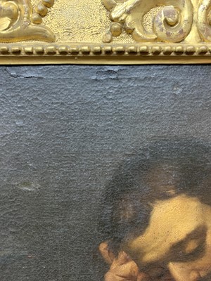 Lot 413 - READING MAN, AN OIL IN THE MANNER OF CARAVAGGIO