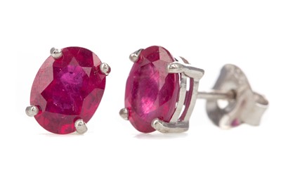 Lot 1132 - A PAIR OF TREATED RUBY STUD EARRINGS