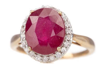 Lot 1178 - A RUBY AND GEM SET CLUSTER RING