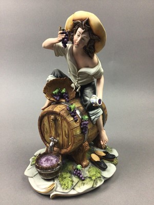 Lot 203 - A CAPODIMONTE PORCELAIN FIGURE 'WATERING THE WINE'