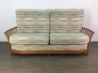 Lot 165 - AN ERCOL RENAISSANCE THREE SEAT SETTEE