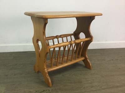 Lot 169 - AN ERCOL MAGAZINE RACK