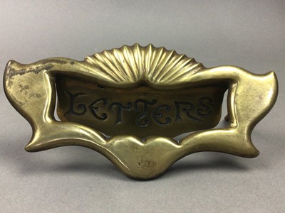 Lot 176 - AN EARLY 20TH CENTURY BRASS LETTER PLATE AND A BALUSTRADE END