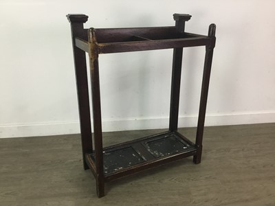 Lot 228 - AN OAK STICK STAND AND A TOWEL RAIL