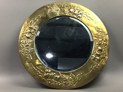 Lot 277 - AN ARTS AND CRAFTS CIRCULAR BRASS WALL MIRROR