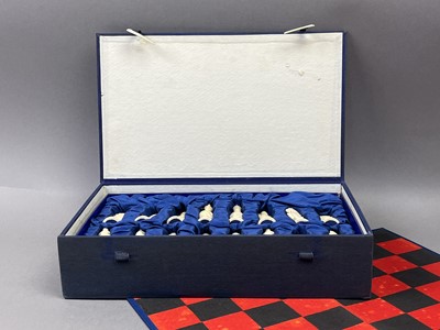 Lot 321 - A CHINESE CARVED BONE FIGURAL CHESS SET