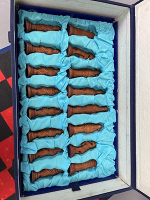 Lot 321 - A CHINESE CARVED BONE FIGURAL CHESS SET