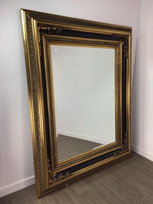 Lot 734 - A LARGE CONTEMPORARY GILT AND MOULDED WALL MIRROR