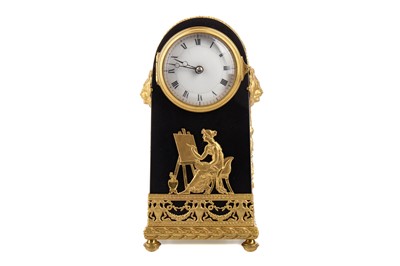 Lot 690 - A FRENCH EMPIRE EBONISED DOMED MANTEL CLOCK