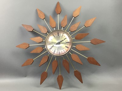 Lot 367 - A TEAK AND BRASS WALL CLOCK AND A TABLE LAMP