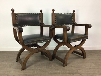 Lot 557 - A PAIR OF OAK X-FRAME CHAIRS