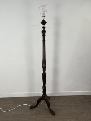 Lot 558 - A CARVED STANDARD LAMP