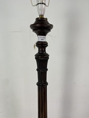 Lot 558 - A CARVED STANDARD LAMP