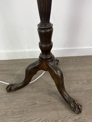 Lot 558 - A CARVED STANDARD LAMP