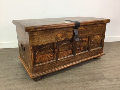 Lot 563 - A CARVED HARDWOOD BLANKET CHEST
