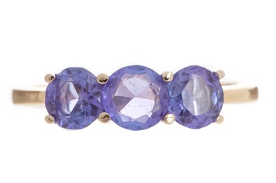 Lot 419 - TANZANITE THREE STONE RING