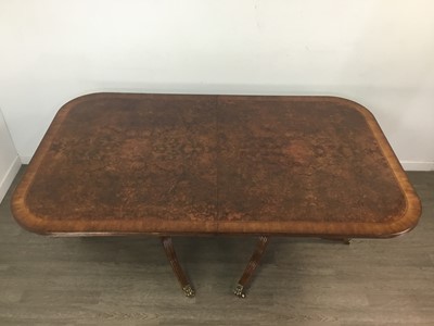 Lot 890 - A GOOD QUALITY REPRODUCTION WALNUT TWIN PEDESTAL DINING TABLE AND TEN CHAIRS