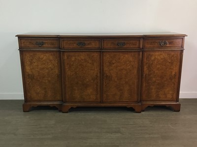 Lot 890 - A GOOD QUALITY REPRODUCTION WALNUT TWIN PEDESTAL DINING TABLE AND TEN CHAIRS