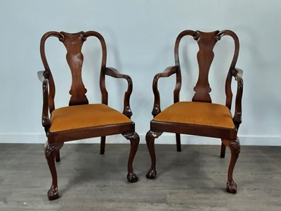 Lot 890 - A GOOD QUALITY REPRODUCTION WALNUT TWIN PEDESTAL DINING TABLE AND TEN CHAIRS