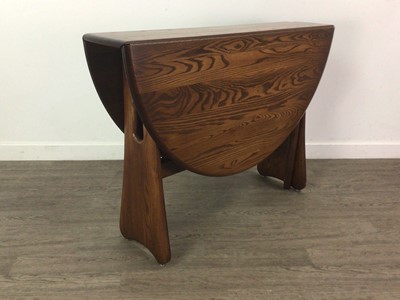 Lot 160a - AN ERCOL STAINED ELM DROP LEAF DINING TABLE