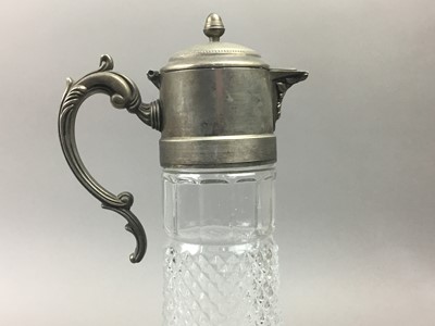 Lot 53 - A MOULDED GLASS CLARET JUG WITH PLATED MOUNT