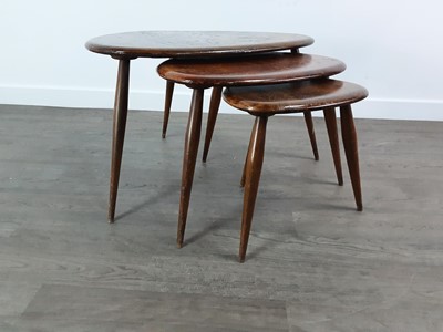 Lot 457 - ERCOL, NEST OF MODEL 354 STAINED ELM 'PEBBLE' TABLES